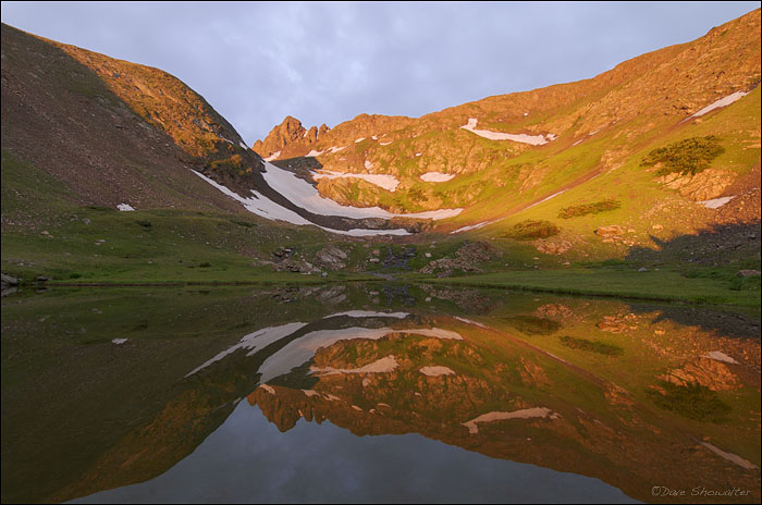 The Continental Divide reflected in a tarn at the headwaters of South Boulder Creek, James Peak Wilderness, CO